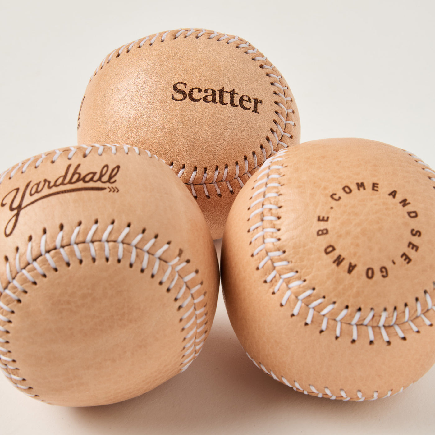 Close-up of a custom Yardball with a brand logo embossed into the leather.