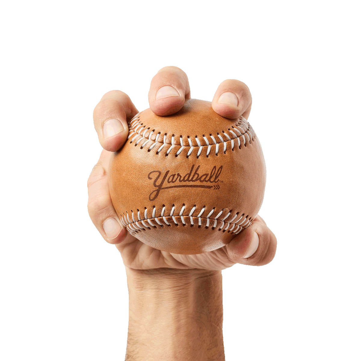 A hand squeezing a Glove Tan Yardball, the ball giving under the fingers