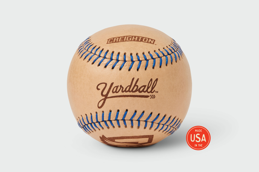 Creighton University Yardball, natural leather with blue stitching