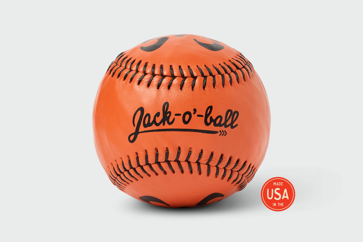 Jack-O-Ball - LPR #12 orange handmade Yardball with spooky jack-o-lantern face design, black stitching, Jack-o-ball script branding, and Made USA seal - Halloween toss ball